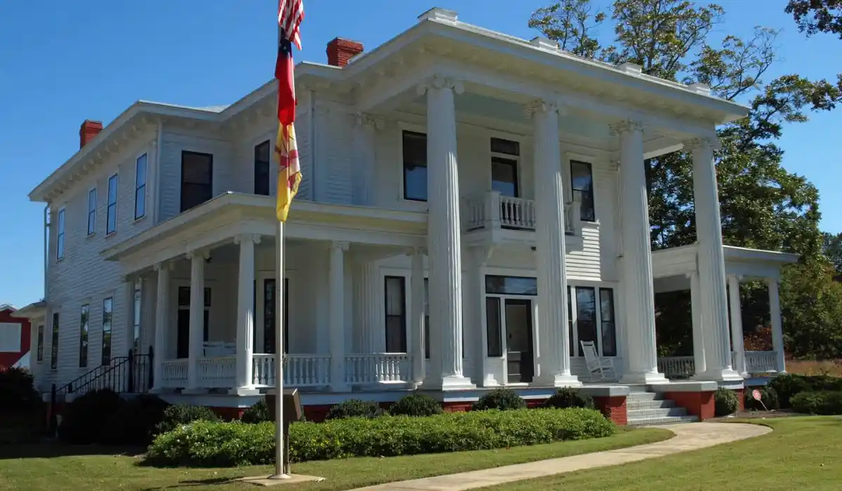 Historic white columned building in downtown Braselton, GA