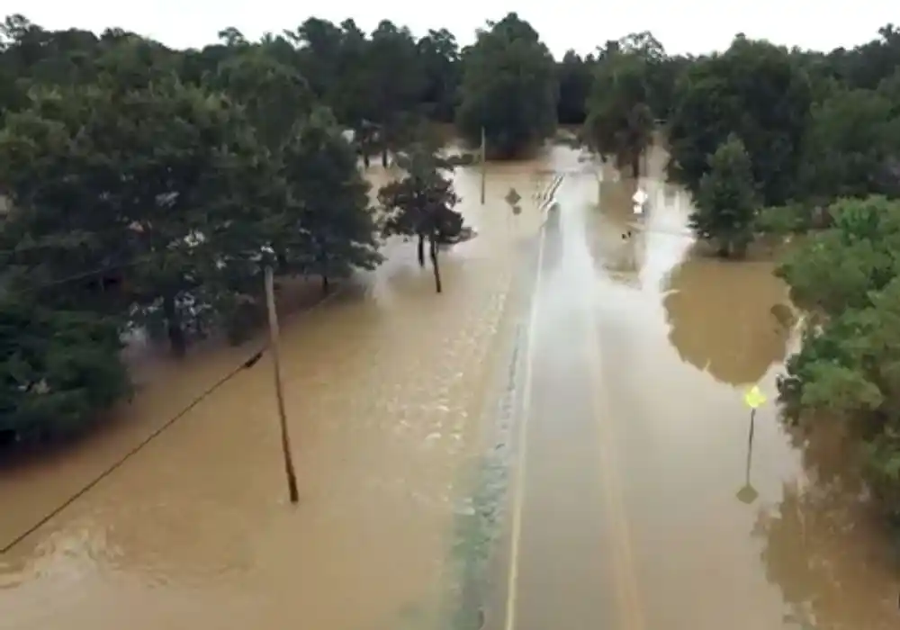 Aerial view of a flooded Georgia road after heavy rain, the kind of event that leads to a water damage insurance claim