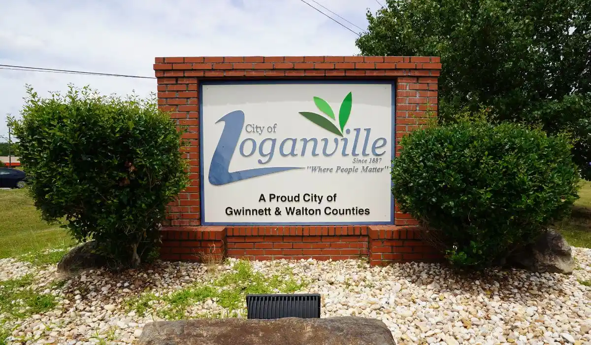 City of Loganville, GA welcome sign surrounded by landscaping