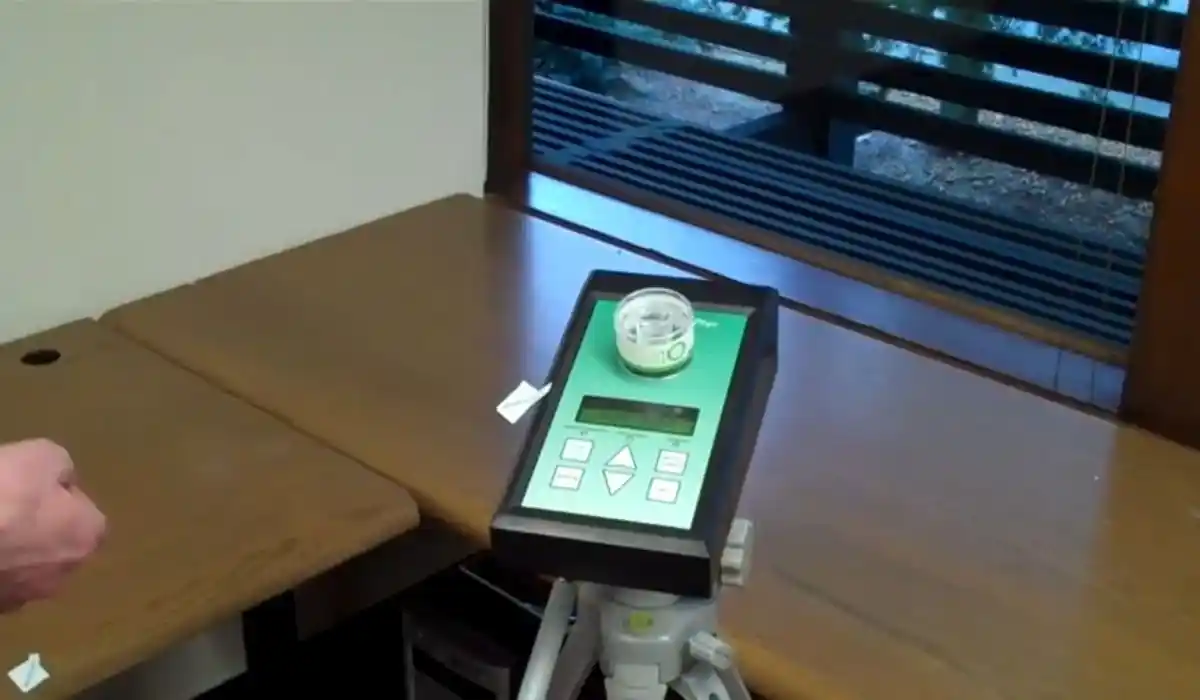 Air quality testing equipment set up on a desk during mold testing